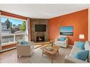 105-205 5 Avenue Ne, Calgary, AB  - Indoor Photo Showing Living Room With Fireplace 