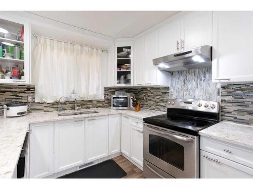 72 Tararidge Close Ne, Calgary, AB - Indoor Photo Showing Kitchen With Double Sink