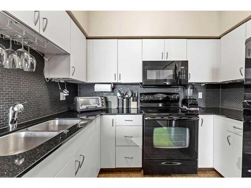 1217-8710 Horton Road Sw, Calgary, AB - Indoor Photo Showing Kitchen With Double Sink