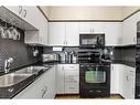 1217-8710 Horton Road Sw, Calgary, AB  - Indoor Photo Showing Kitchen With Double Sink 