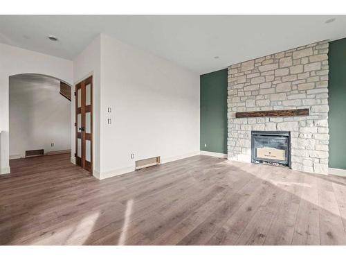 721 Mandalay Link, Carstairs, AB - Indoor Photo Showing Living Room With Fireplace