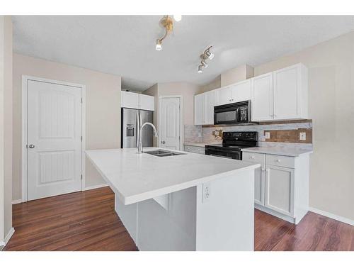 503-800 Yankee Valley Boulevard Se, Airdrie, AB - Indoor Photo Showing Kitchen With Double Sink