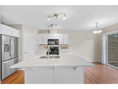 503-800 Yankee Valley Boulevard Se, Airdrie, AB - Indoor Photo Showing Kitchen With Double Sink With Upgraded Kitchen