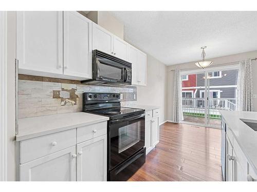 503-800 Yankee Valley Boulevard Se, Airdrie, AB - Indoor Photo Showing Kitchen