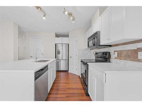 503-800 Yankee Valley Boulevard Se, Airdrie, AB - Indoor Photo Showing Kitchen With Double Sink With Upgraded Kitchen