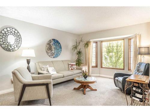 104 Millbank Close Sw, Calgary, AB - Indoor Photo Showing Living Room