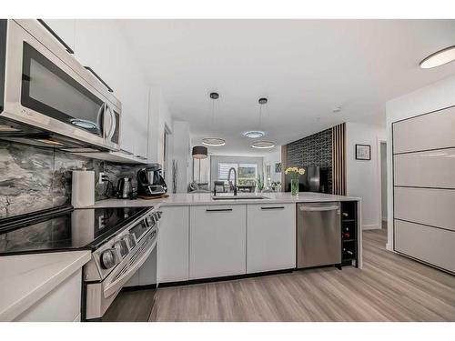 228-22 Richard Place Sw, Calgary, AB - Indoor Photo Showing Kitchen With Stainless Steel Kitchen