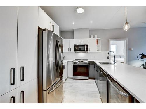 131-69 Springborough Court Sw, Calgary, AB - Indoor Photo Showing Kitchen With Stainless Steel Kitchen With Double Sink With Upgraded Kitchen