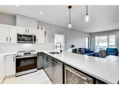 131-69 Springborough Court Sw, Calgary, AB - Indoor Photo Showing Kitchen With Stainless Steel Kitchen With Double Sink With Upgraded Kitchen