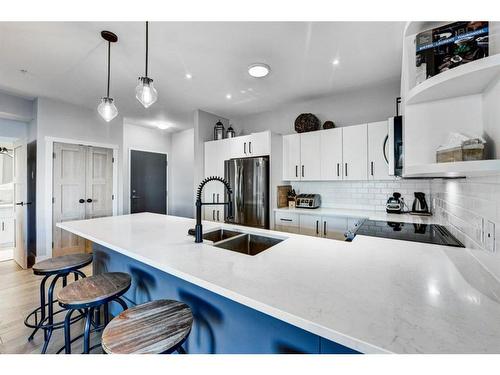 131-69 Springborough Court Sw, Calgary, AB - Indoor Photo Showing Kitchen With Stainless Steel Kitchen With Double Sink With Upgraded Kitchen