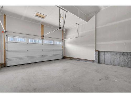 957 Cobblemore Common Sw, Airdrie, AB - Indoor Photo Showing Garage