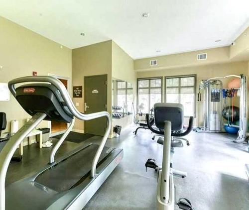 4209-92 Crystal Shores Road, Okotoks, AB - Indoor Photo Showing Gym Room