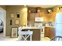 4209-92 Crystal Shores Road, Okotoks, AB  - Indoor Photo Showing Kitchen 