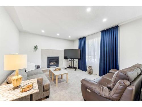 359 Mountain Park Drive Se, Calgary, AB - Indoor Photo Showing Living Room With Fireplace