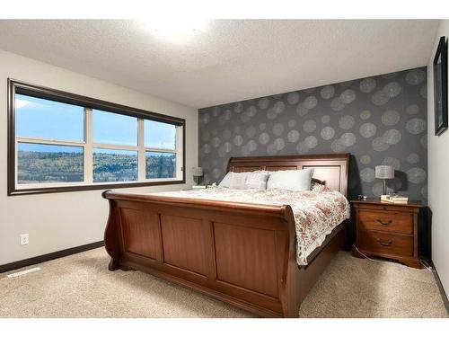 263 Sunset View, Cochrane, AB - Indoor Photo Showing Bedroom