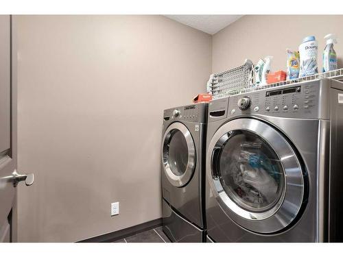 263 Sunset View, Cochrane, AB - Indoor Photo Showing Laundry Room