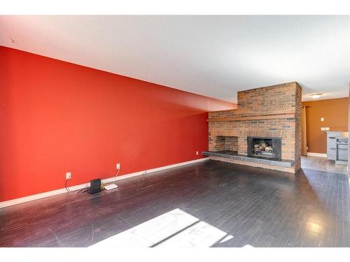 5032 Whitestone Road Ne, Calgary, AB - Indoor Photo Showing Other Room With Fireplace