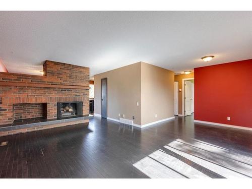 5032 Whitestone Road Ne, Calgary, AB - Indoor Photo Showing Living Room With Fireplace