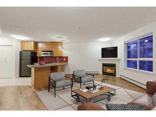 155-35 Richard Court Sw, Calgary, AB - Indoor With Fireplace