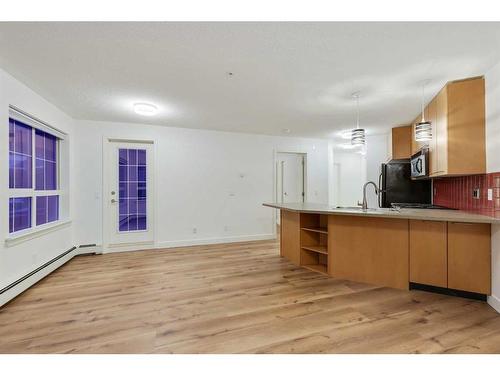 155-35 Richard Court Sw, Calgary, AB - Indoor Photo Showing Kitchen