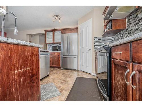 57 Saddlecrest Park Ne, Calgary, AB - Indoor Photo Showing Kitchen With Stainless Steel Kitchen