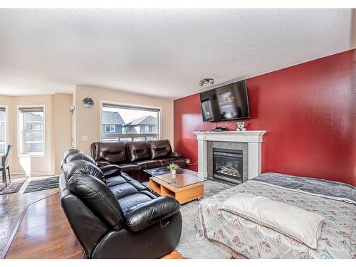 57 Saddlecrest Park Ne, Calgary, AB - Indoor Photo Showing Living Room With Fireplace