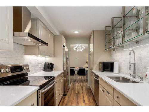 402-1229 Cameron Avenue Sw, Calgary, AB - Indoor Photo Showing Kitchen With Stainless Steel Kitchen With Double Sink