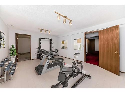 513 Hawkstone Drive Nw, Calgary, AB - Indoor Photo Showing Gym Room