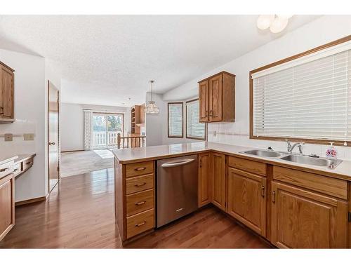 513 Hawkstone Drive Nw, Calgary, AB - Indoor Photo Showing Kitchen With Double Sink