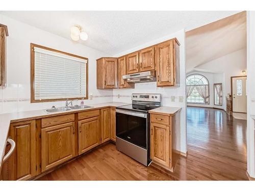 513 Hawkstone Drive Nw, Calgary, AB - Indoor Photo Showing Kitchen With Double Sink