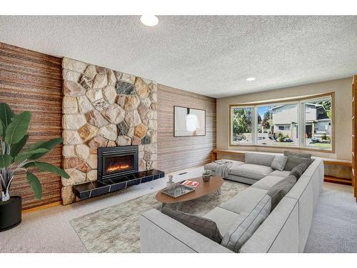 5848 Lodge Crescent Sw, Calgary, AB - Indoor Photo Showing Living Room With Fireplace