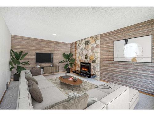 5848 Lodge Crescent Sw, Calgary, AB - Indoor Photo Showing Living Room With Fireplace