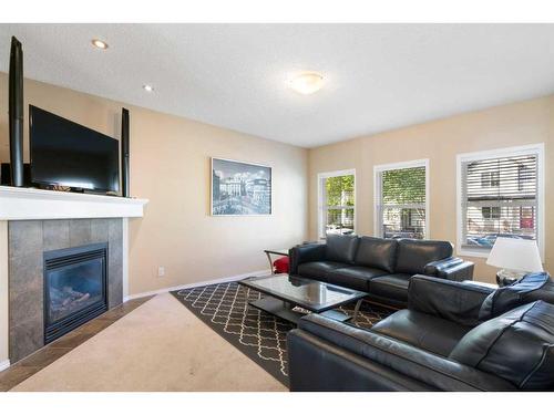 67 Elgin View Se, Calgary, AB - Indoor Photo Showing Living Room With Fireplace