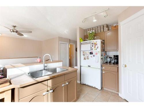 184 Hidden Creek Gardens Nw, Calgary, AB - Indoor Photo Showing Kitchen With Double Sink