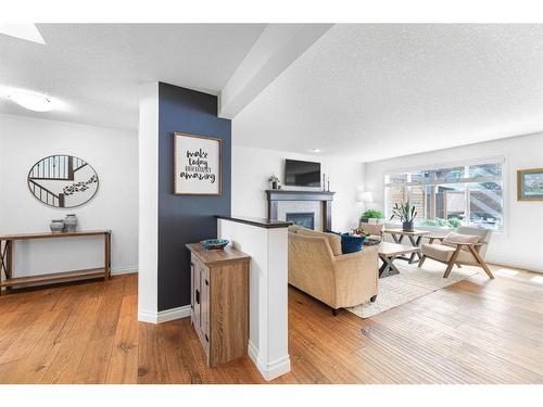 7 Jumping Pound Terrace, Cochrane, AB - Indoor Photo Showing Living Room With Fireplace