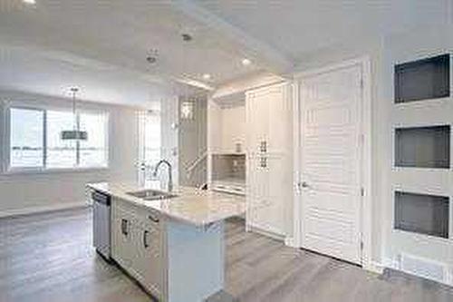 145 Cobblestone Gate Sw, Airdrie, AB - Indoor Photo Showing Kitchen With Upgraded Kitchen