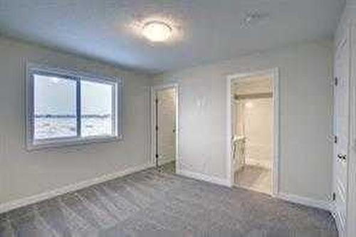 145 Cobblestone Gate Sw, Airdrie, AB - Indoor Photo Showing Other Room