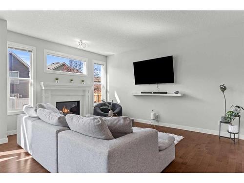 305 Evanspark Gardens Nw, Calgary, AB - Indoor Photo Showing Living Room With Fireplace