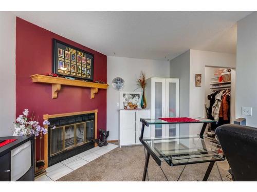 5724 58 Avenue, Olds, AB - Indoor Photo Showing Living Room With Fireplace