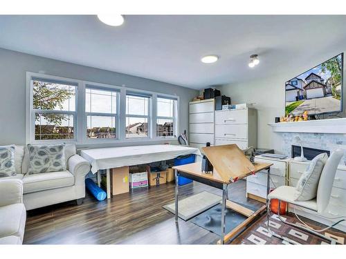 11 Saddlebrook Way Ne, Calgary, AB - Indoor Photo Showing Living Room With Fireplace