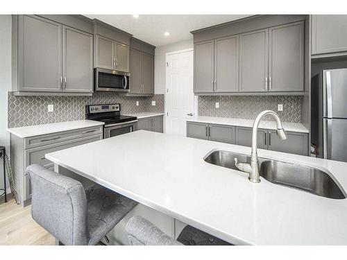 24 Carrington Rise Nw, Calgary, AB - Indoor Photo Showing Kitchen With Double Sink With Upgraded Kitchen