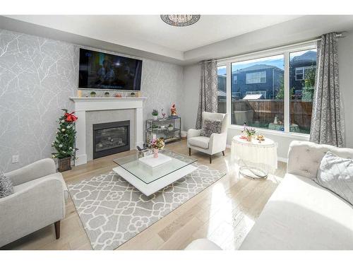 24 Carrington Rise Nw, Calgary, AB - Indoor Photo Showing Living Room With Fireplace