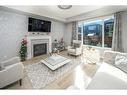 24 Carrington Rise Nw, Calgary, AB  - Indoor Photo Showing Living Room With Fireplace 