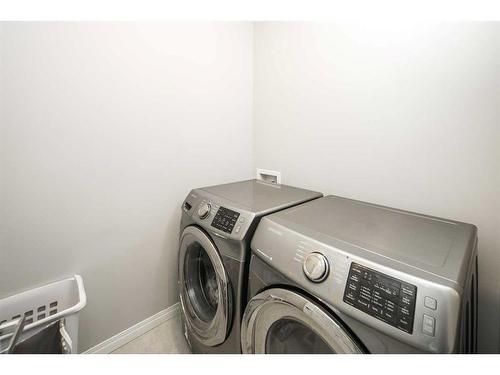 24 Carrington Rise Nw, Calgary, AB - Indoor Photo Showing Laundry Room