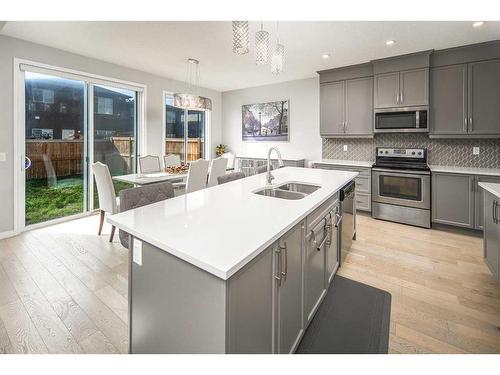 24 Carrington Rise Nw, Calgary, AB - Indoor Photo Showing Kitchen With Double Sink