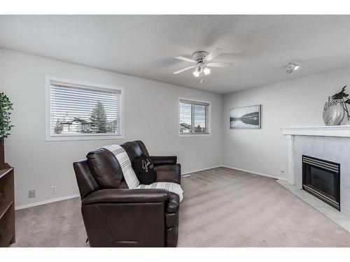 241 Scotia Point Nw, Calgary, AB - Indoor Photo Showing Living Room With Fireplace