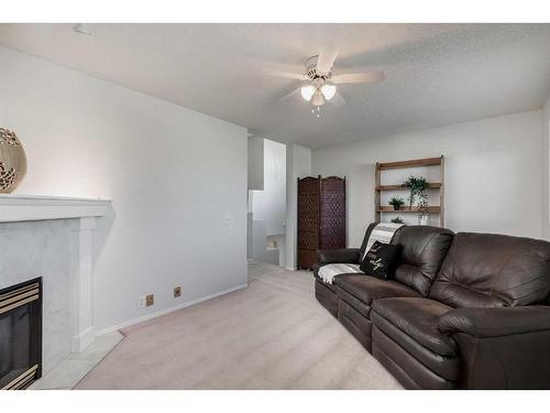 241 Scotia Point Nw, Calgary, AB - Indoor Photo Showing Living Room With Fireplace