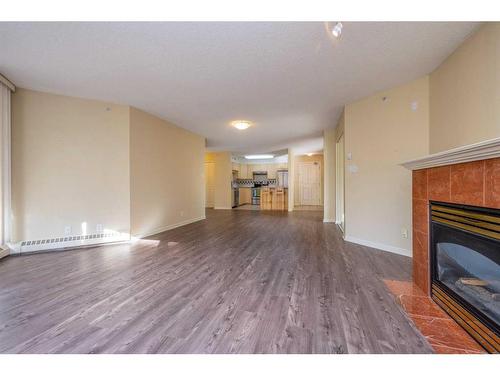 206-804 3 Avenue Sw, Calgary, AB - Indoor Photo Showing Living Room With Fireplace