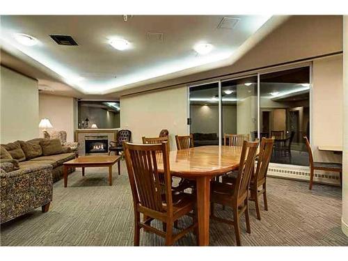 206-804 3 Avenue Sw, Calgary, AB - Indoor Photo Showing Dining Room With Fireplace