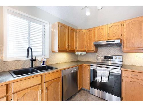 62 Shawbrooke Crescent Sw, Calgary, AB - Indoor Photo Showing Kitchen With Double Sink